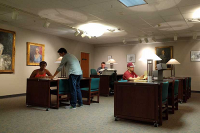 Interior of Claude pepper library, students sitting at various tables studying